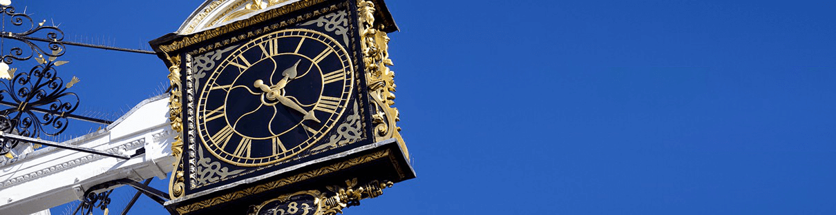 Black & Gold Clock on Building